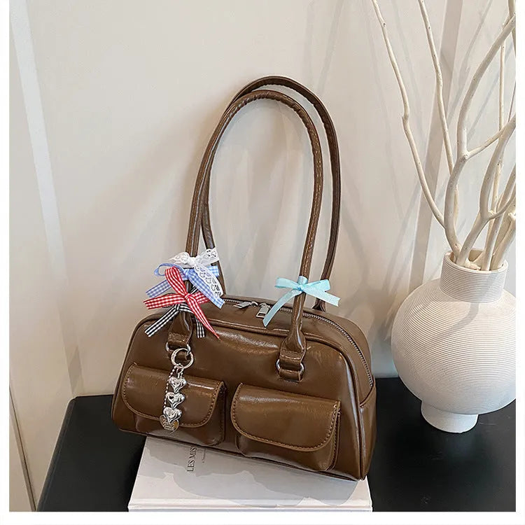 Retro pillow-shaped women's handbag in PU leather with double shoulder straps and flap closure