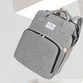 Lightweight nylon portable mummy bag with USB port and curved shoulder strap in various colours.