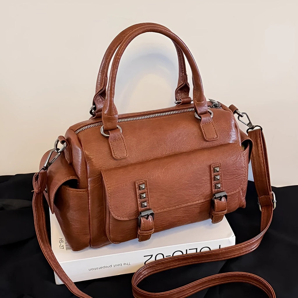 Vintage-style messenger bag in horizontal square shape with contrast stitching, shown in available colour options