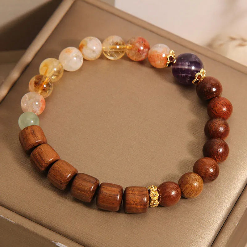 Women's bracelet in yellow tower crystal and amethyst tones with pearl and rhinestone decorative elements