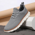 Men's grey mesh fabric casual sneakers with round toe and low heel design