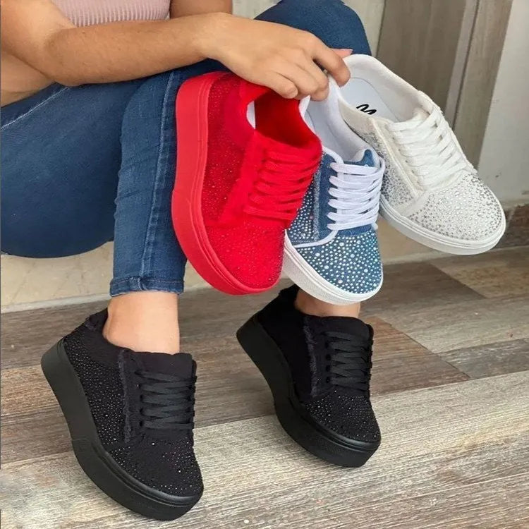 Women's plus size black casual sports shoes with rhinestones on the upper and a flat rubber sole.