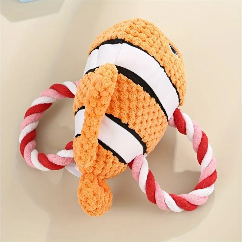 Grey turtle-shaped stuffed dog toy with a visible rope knot centre for chewing.