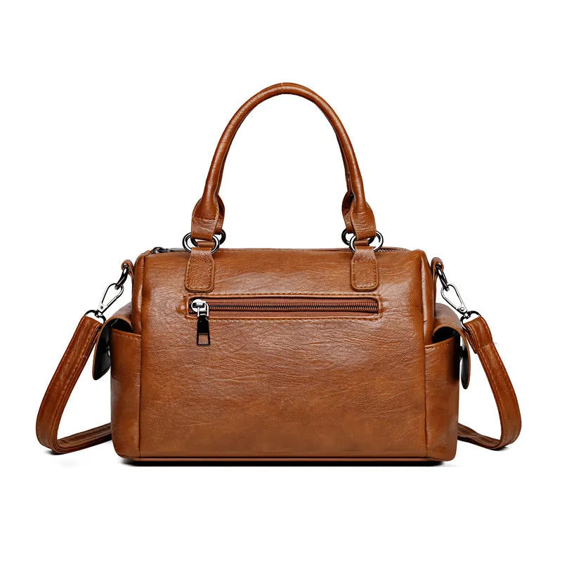 Vintage-style messenger bag in horizontal square shape with contrast stitching, shown in available colour options