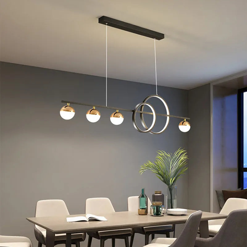 Modern rectangular aluminium ceiling light in black or gold with remote control on a white background.