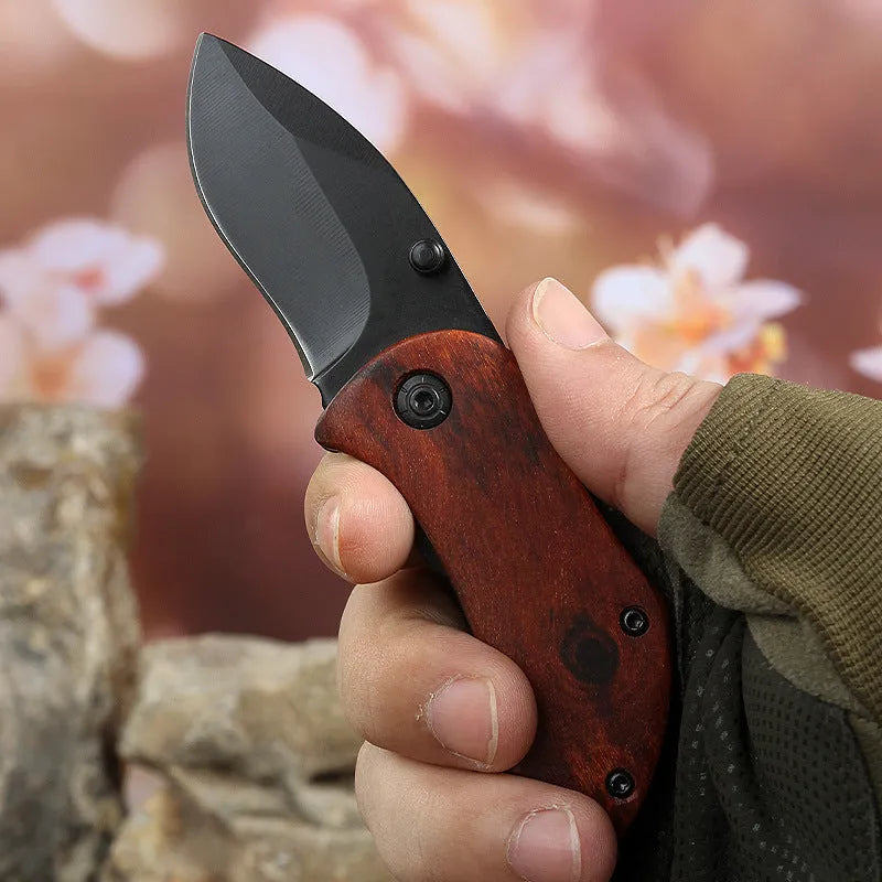Stainless steel folding mini fruit knife with red handle and 5.5cm blade on keychain