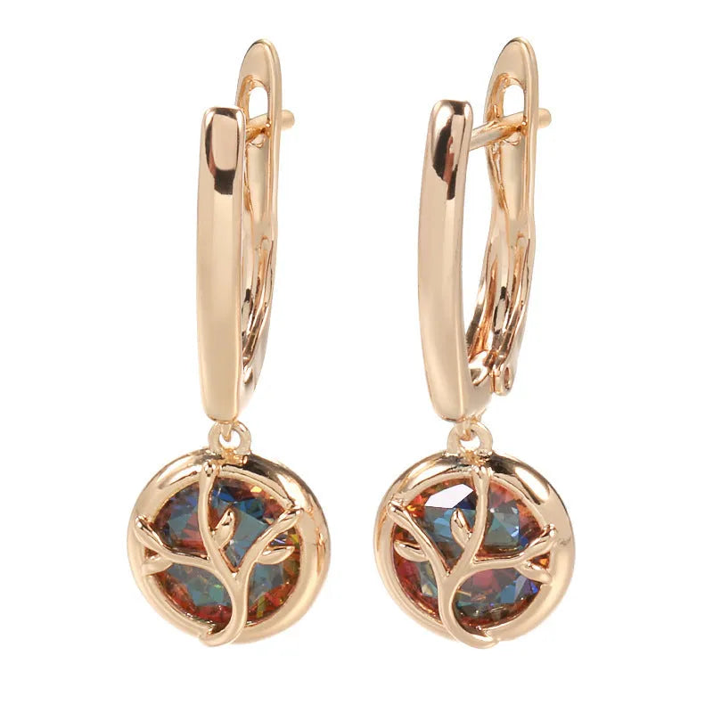 Rose gold plated copper drop earrings with artificial gemstone inlay on white background
