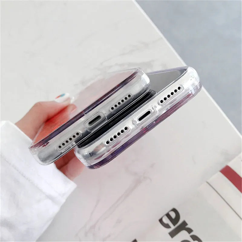 Quicksand flowing love heart silicone phone case in transparent soft TPU bumper for iPhone, available in pink red silver.