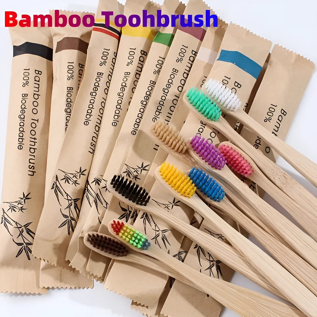 10 multi-coloured natural bamboo toothbrushes with soft charcoal bristles arranged on a white background