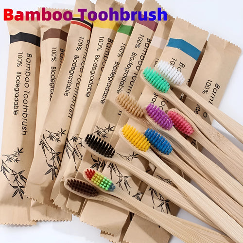 10 multi-coloured natural bamboo toothbrushes with soft charcoal bristles arranged on a white background