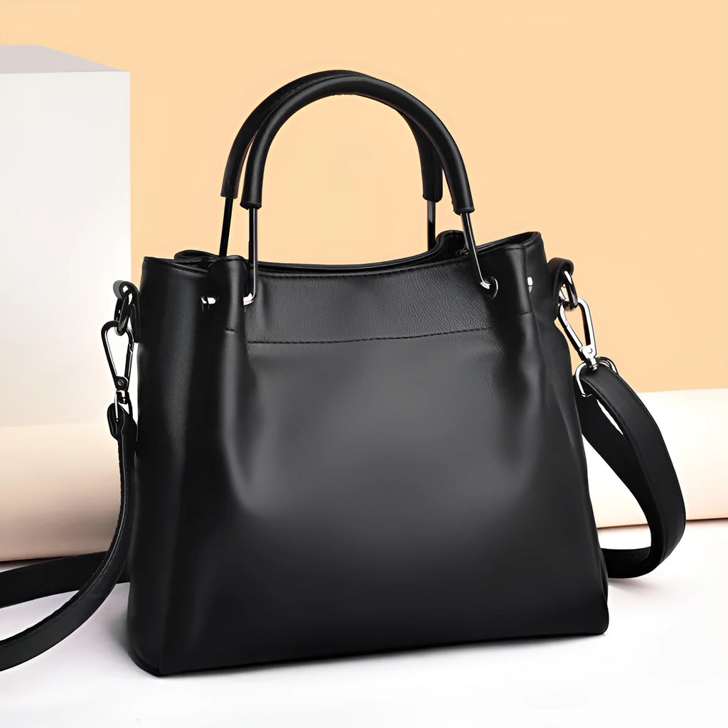Leisure soft leather bucket bag in black with slit pocket and visible sewing thread detail for commuting