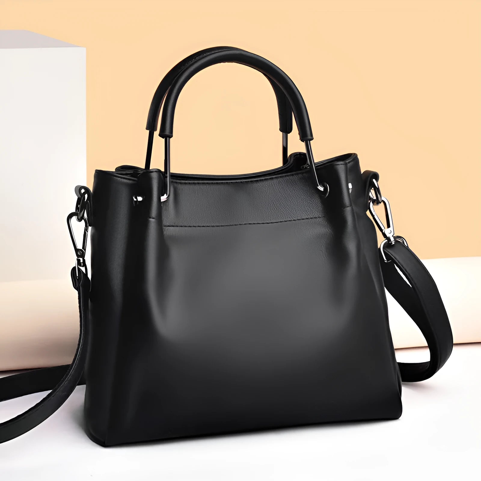 Leisure soft leather bucket bag in black with slit pocket and visible sewing thread detail for commuting