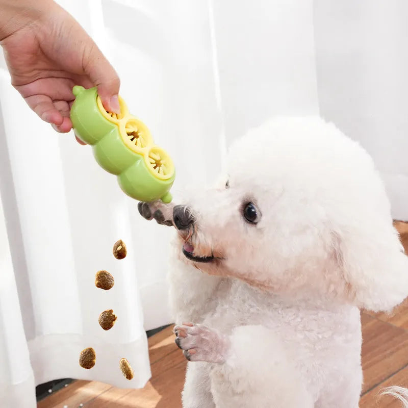 Green dog puzzle toy with food leak openings and bite-resistant material on a white background