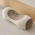 Buckwheat three-dimensional neck pillow in beige colour on a bed
