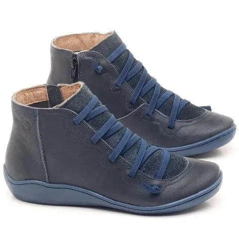 Women's casual flat booties in various colours with a round toe and wedge heel.