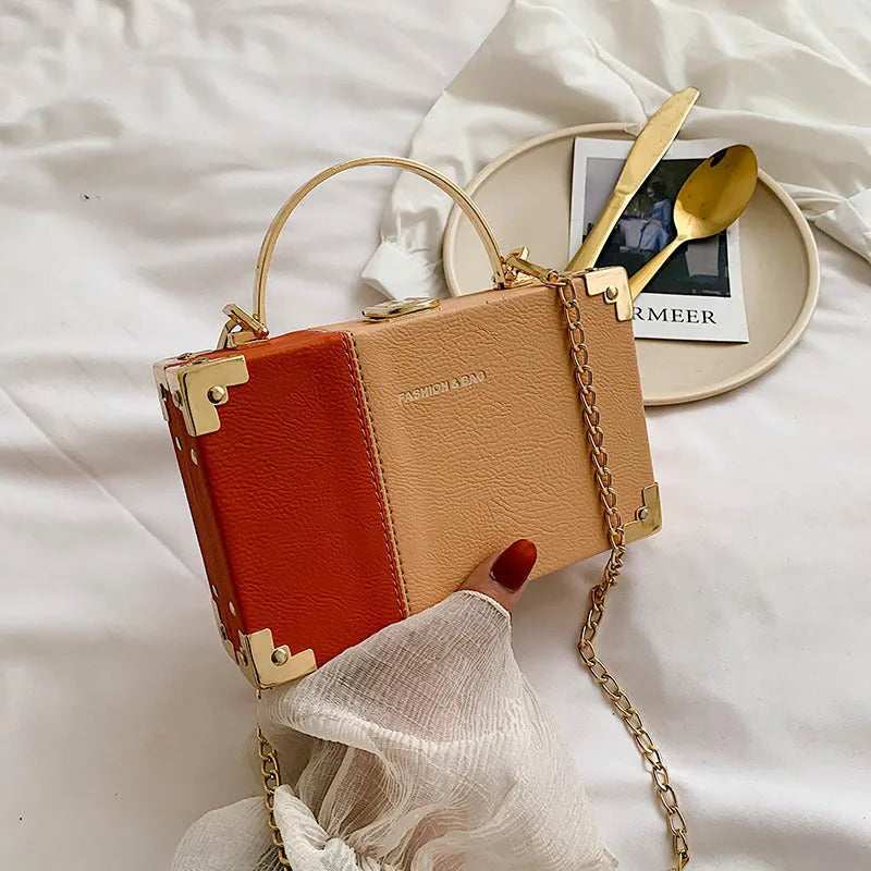Handle box design clutch bag in orange with long chain, PU leather, 19cm length