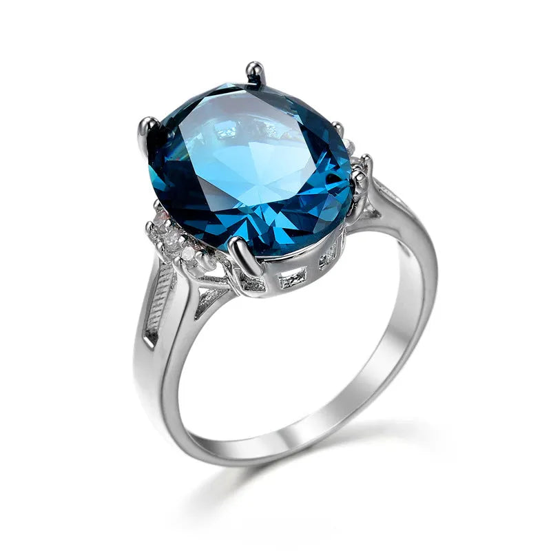 Geometric copper ring with a blue black elliptical zircon stone in a retro unisex style.