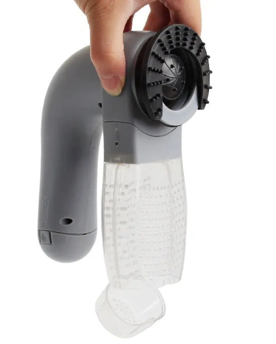 Grey portable electric pet hair remover vacuum with soft rubber grooming head for dogs and cats.