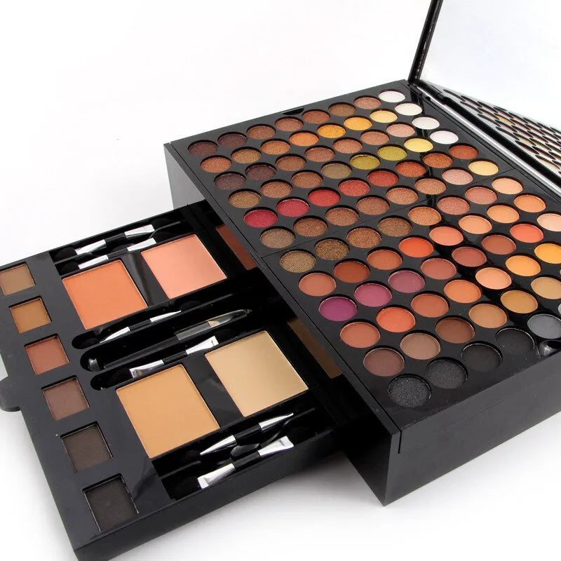 Piano-shaped makeup palette open to show 190 colour pans including eyeshadows, blushes, and powders.