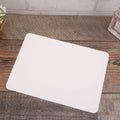 Pack of 100 blank folded kraft cards in 10x15cm size on a craft table