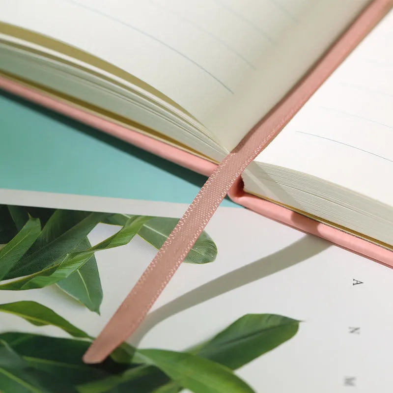A5 tactile PU hardcover notebook with 96 sheets of 100gsm white paper, available in ten colours including black and red