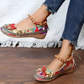 Women's black ethnic style platform sandals with elastic band and round toe on a cloth upper.