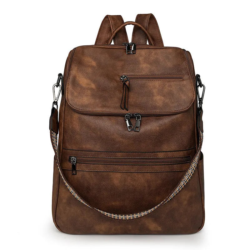 PU leather college backpack with curved shoulder strap in solid colour with stitching detail.