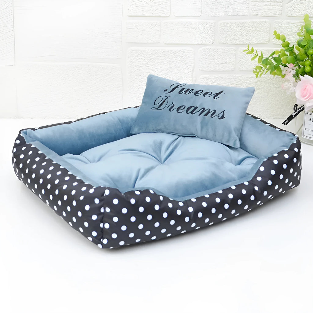 Small polka dot dog bed with a matching square pillow, shown in rose red colour