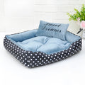 Small polka dot dog bed with a matching square pillow, shown in rose red colour