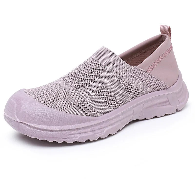 Women's slip-on shoe covers with cloth uppers and PVC soles in black, milky white, and purple colours