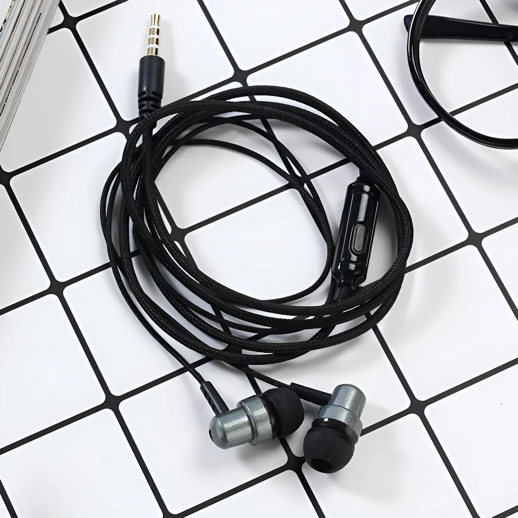 Black wired in-ear gaming headset with 3.5mm plug, braided cable, and silicone ear tips