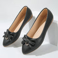 Women's beige casual flat shoes with a bowknot detail on the artificial PU upper.