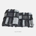 Modern grey and white plaid bed runner set with nap blanket and leather round pillow on a 1.8m bed.