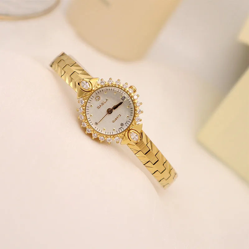 Gold quartz watch with embossed bracelet featuring 5A diamond detailing