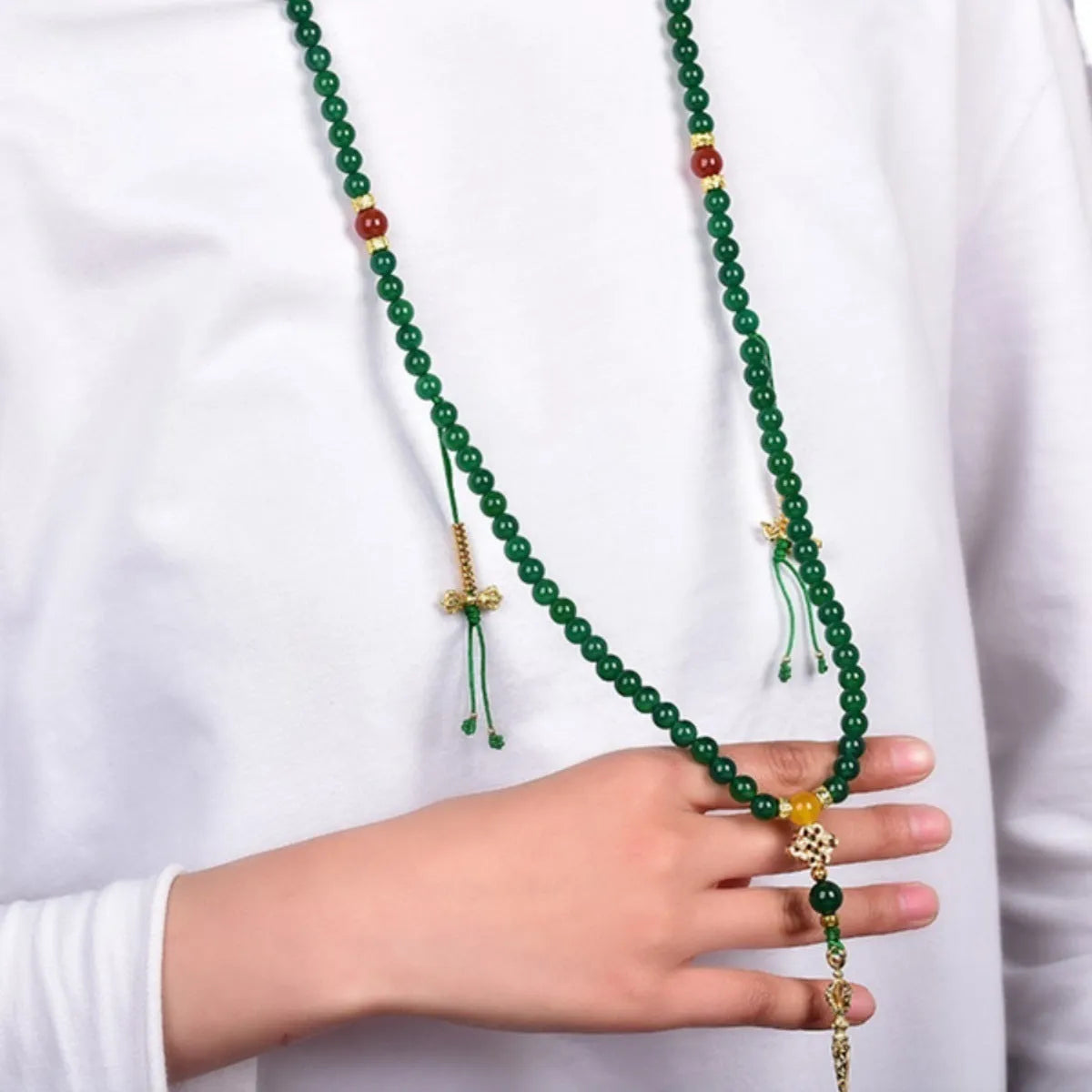 Natural green agate multi-circle bracelet for men and women on a wrist, showing different bead size options.
