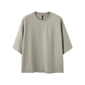 Men's sand grey loose fit short sleeve cotton polyester t-shirt laid flat.