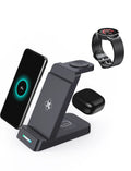 Black and white 3-in-1 wireless charging station for phone, AirPods, and smartwatch on a desk.