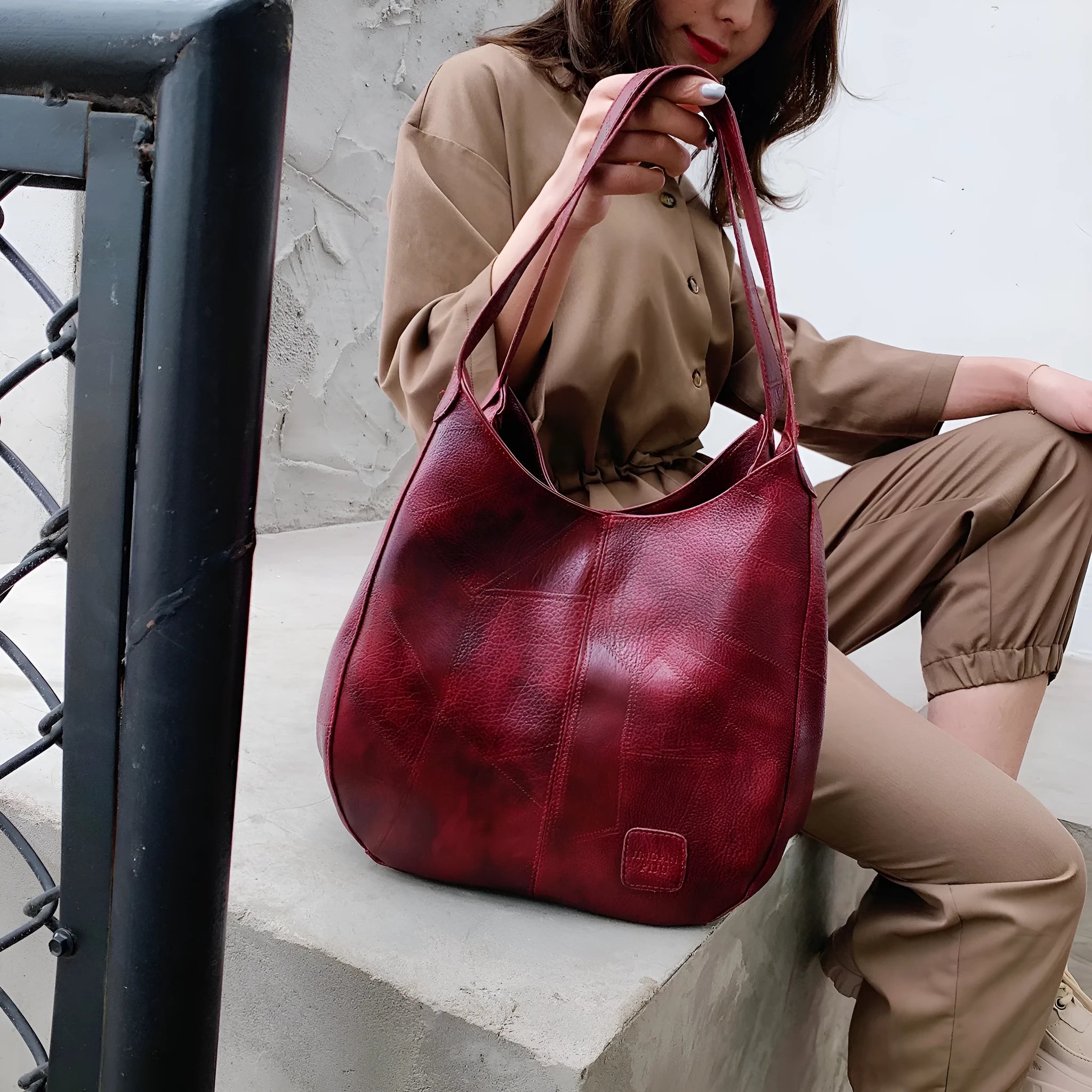 Vintage women's large PU shoulder tote bag in solid colour with double straps and magnetic buckle closure.