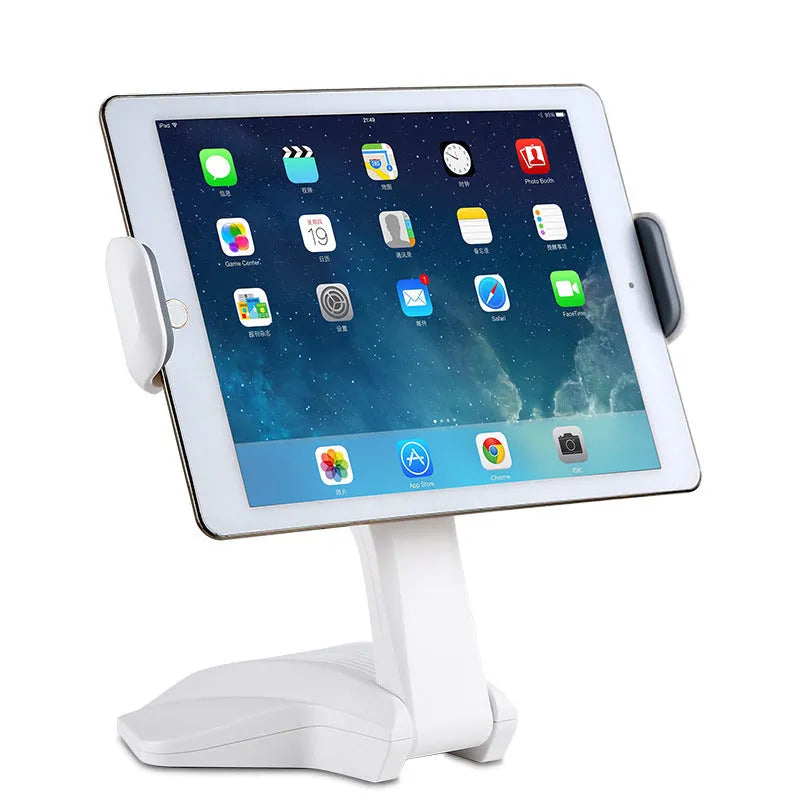 White aluminium tablet stand on a desk, showing its height and the adjustable clip for 7-15 inch devices.