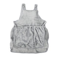 Plush pet carrier apron for small cats and dogs shown in beige, with adjustable neck and head opening.