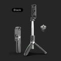 Black and white Bluetooth selfie stick with wireless remote, extended with phone mounted on 360-degree head and tripod base deployed.