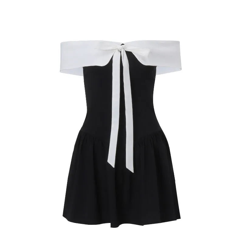 Black off-shoulder lace-up waist trimming short-sleeved A-line dress with bow and contrast stitching on a model