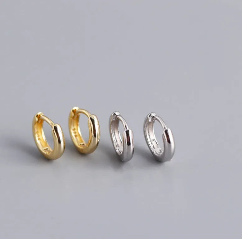 Women's sterling silver round stud earrings in gold and silver finishes