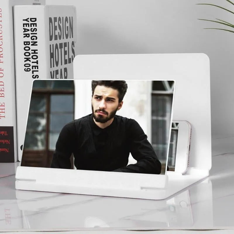 Black and white phone screen amplifier with 9 inch screen and built-in smartphone holder.