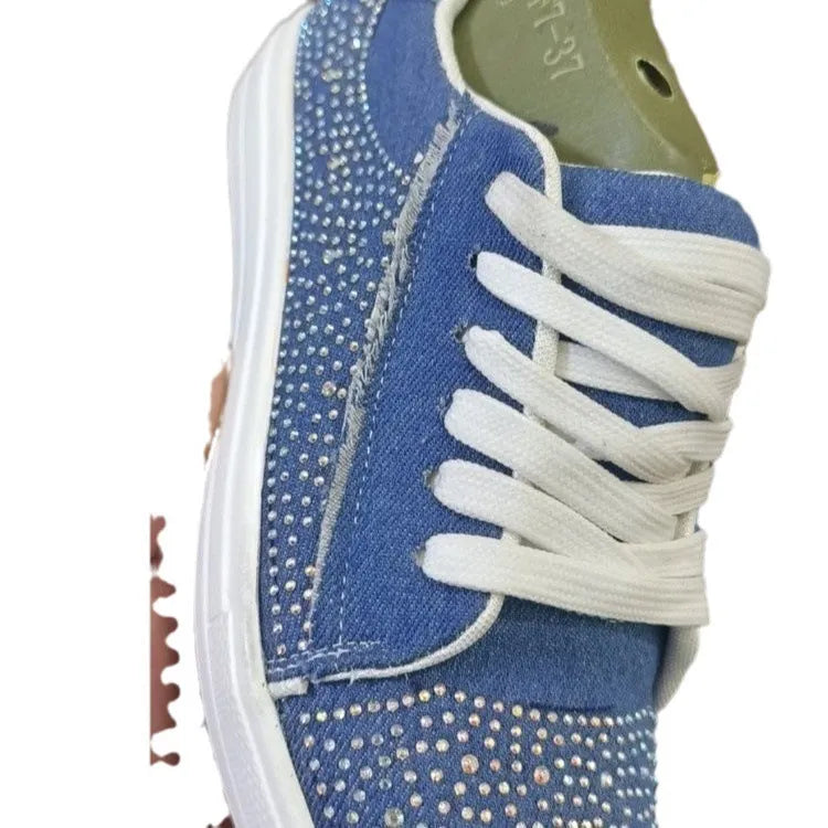 Women's plus size black casual sports shoes with rhinestones on the upper and a flat rubber sole.