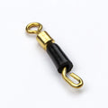 Close-up of a silver wire fishing swivel clip with a black silicone opening, shown next to a fishing lure hook.