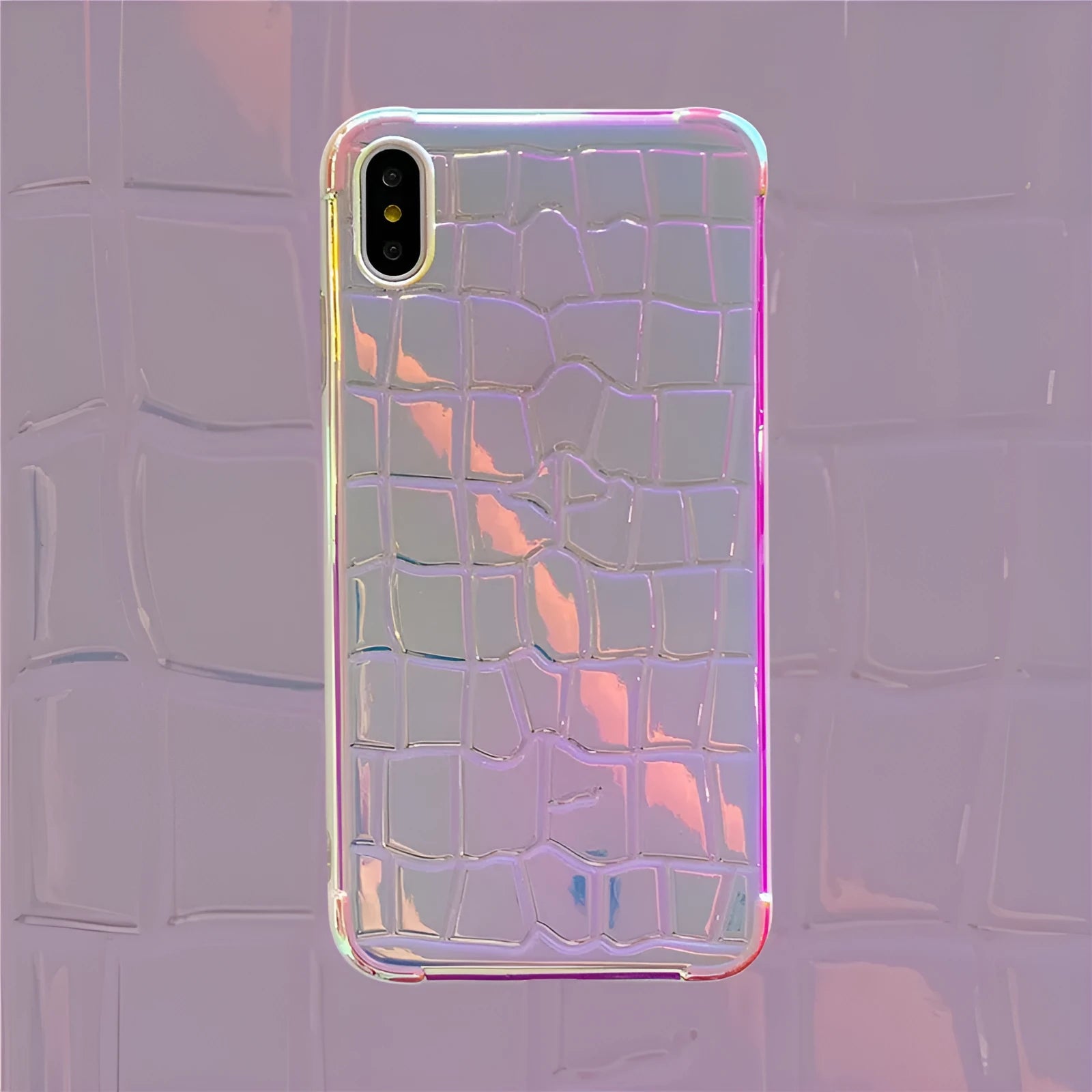 Silver laser finish silicone iPhone case showing glossy texture and protective design