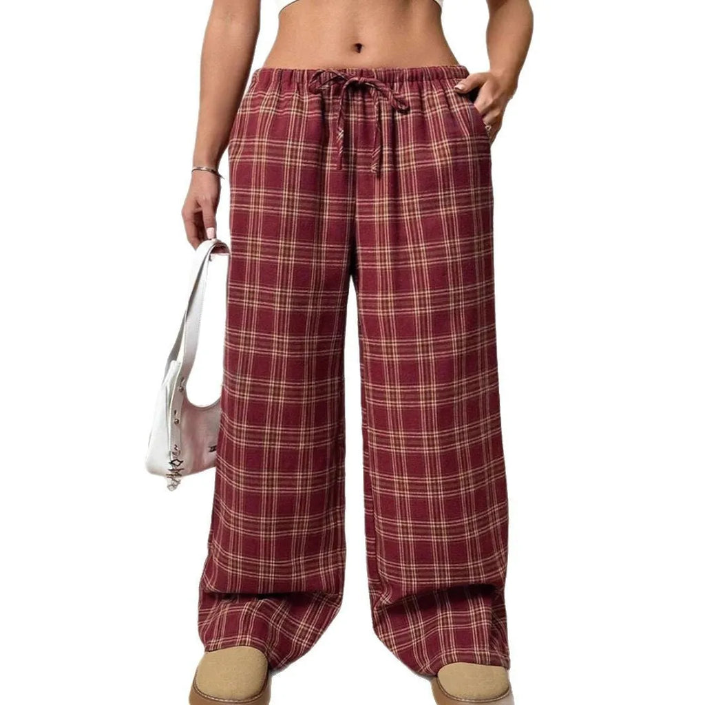 Women's red casual loose trousers with drawstring waist and plaid pockets on mannequin