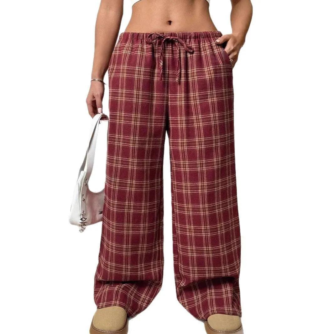 Women's red casual loose trousers with drawstring waist and plaid pockets on mannequin