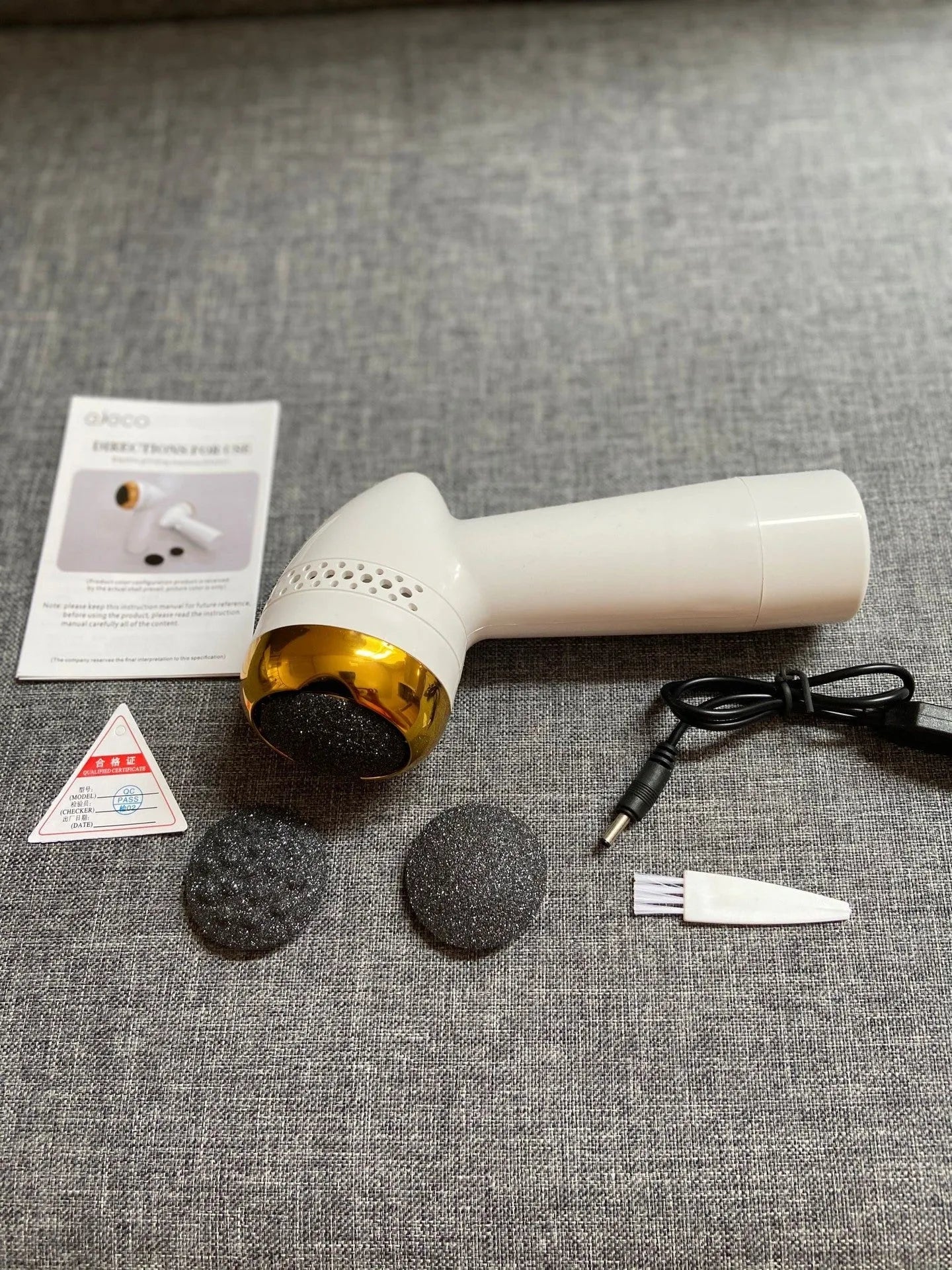 Electric foot grinder with refined quartz grinding head in gold, silver, and pink finish options.
